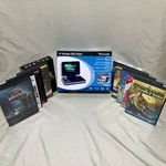 Venturer 8 Portable Dvd Player New Pvs8380 With 10 Dvds. Fixed Price $50.00.