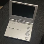 Polaroid Pdm-0722 Portable 7in Tft-lcd Dvd Player, Silver, Region 1. Fixed Price $20.00.